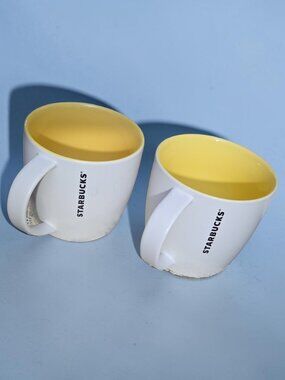 Two Starbucks White with Yellow Inside Ceramic Mugs 2011